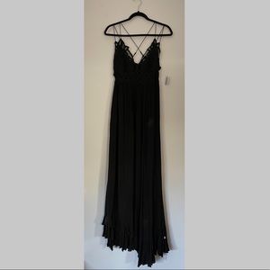Black strappy free people’s dress.